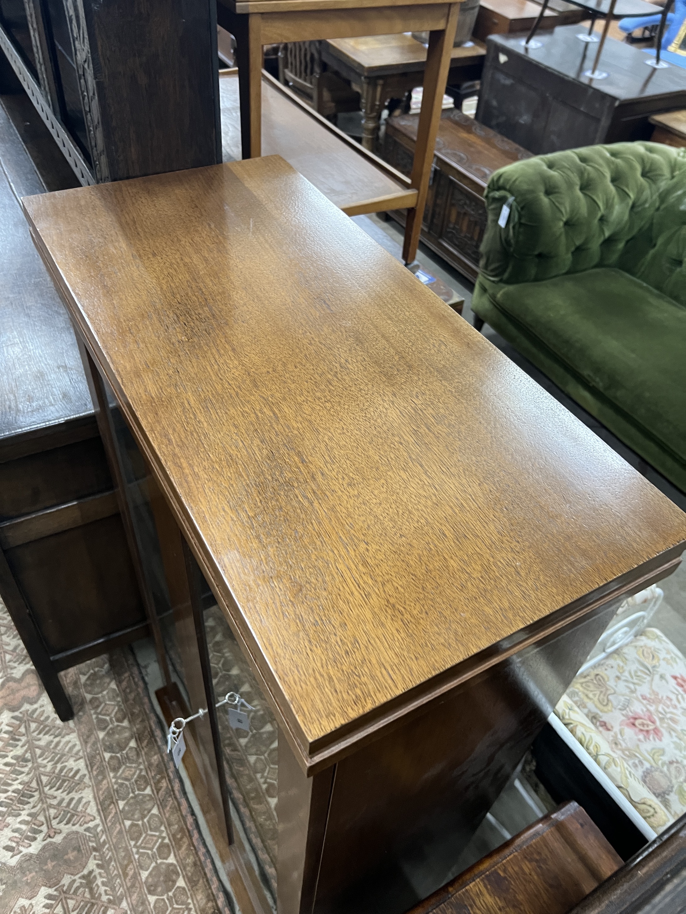 A South African mahogany glazed two door bookcase, width 75cm, depth 35cm, height 135cm